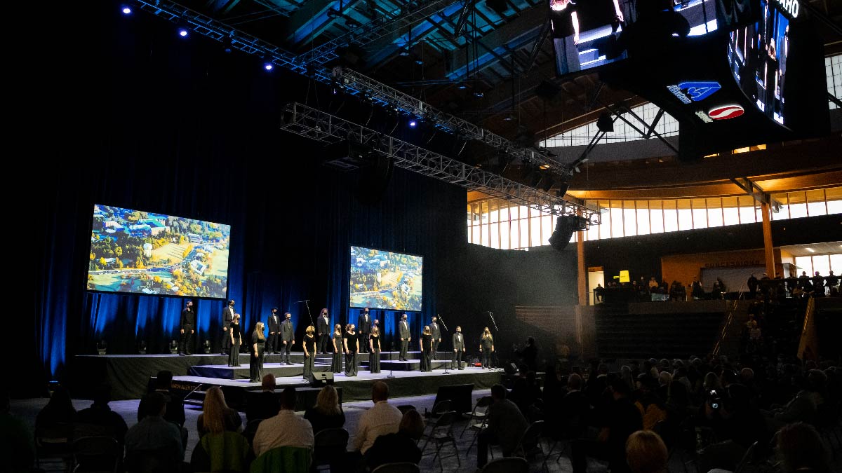 Students sing "Here We Have Idaho" at the Brave and Bold campaign launch in the ICCU arena.